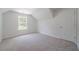 Cozy bedroom features neutral carpet, window for natural light, and a door for easy access at 3961 S River Ln, Ellenwood, GA 30294