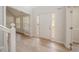 Foyer features wood-look flooring, neutral paint, and a glass-paneled door at 3961 S River Ln, Ellenwood, GA 30294