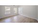 Bright living room features neutral paint and light wood floors at 3961 S River Ln, Ellenwood, GA 30294