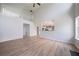 Spacious living room boasts soaring ceilings, wood floors, and an open floor plan at 3961 S River Ln, Ellenwood, GA 30294