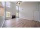 Bright living room features vaulted ceilings, wood floors, and a fireplace at 3961 S River Ln, Ellenwood, GA 30294