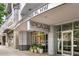 Attractive building entrance at 44 Peachtree Place, with the sign for North The Plaza Midtown at 44 Peachtree Nw Pl # 1828, Atlanta, GA 30309