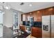 Modern kitchen featuring stainless steel appliances, granite countertops, and dark wood cabinetry at 44 Peachtree Nw Pl # 1828, Atlanta, GA 30309