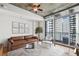 Cozy living room with expansive city views and comfortable modern furniture at 44 Peachtree Nw Pl # 1828, Atlanta, GA 30309