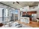 Bright living room with floor-to-ceiling windows and modern decor at 44 Peachtree Nw Pl # 1828, Atlanta, GA 30309