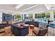 Inviting lounge featuring contemporary furniture, a TV, and views of the outdoor pool area at 44 Peachtree Nw Pl # 1828, Atlanta, GA 30309