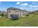 Wide backyard with a trampoline, a playset, a lawn and a tan exterior at 2740 Longacre Park Way, Lawrenceville, GA 30044