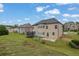 Spacious backyard featuring a large lawn and a play set for to enjoy the outdoors at 2740 Longacre Park Way, Lawrenceville, GA 30044