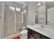 The bathroom boasts a glass shower, tile surround, and a modern vanity at 2740 Longacre Park Way, Lawrenceville, GA 30044