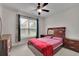 A cozy bedroom features a ceiling fan, neutral walls, and furnishings at 2740 Longacre Park Way, Lawrenceville, GA 30044