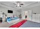 A bedroom features dual beds, a ceiling fan, natural light, and furnishings at 2740 Longacre Park Way, Lawrenceville, GA 30044