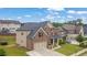 Attractive brick home boasts a spacious lot, attached two-car garage, and well-maintained landscaping at 2740 Longacre Park Way, Lawrenceville, GA 30044