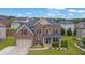 Beautiful two-story brick home featuring a two-car garage, landscaped front yard, and classic architectural details at 2740 Longacre Park Way, Lawrenceville, GA 30044