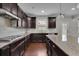 Chef's kitchen boasts granite countertops, stainless appliances, and custom cabinetry at 2740 Longacre Park Way, Lawrenceville, GA 30044
