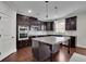 Gourmet kitchen with granite counters, stainless steel appliances, and a large center island at 2740 Longacre Park Way, Lawrenceville, GA 30044