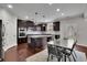 Large kitchen featuring a granite island, modern appliances, and lots of counter space at 2740 Longacre Park Way, Lawrenceville, GA 30044