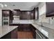 The kitchen has granite counters, stainless steel appliances, and lots of storage space at 2740 Longacre Park Way, Lawrenceville, GA 30044
