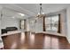 Inviting living room with hardwood floors, large windows, and comfortable seating, perfect for relaxation at 2740 Longacre Park Way, Lawrenceville, GA 30044
