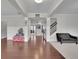 Spacious living room with hardwood floors, modern staircase, and neutral decor, creating a welcoming atmosphere at 2740 Longacre Park Way, Lawrenceville, GA 30044