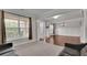 Bright and airy living room features hardwood floors, large windows, and comfortable seating, ideal for entertaining at 2740 Longacre Park Way, Lawrenceville, GA 30044