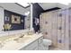 Bathroom with marble countertop, modern fixtures, skylight and shower at 490 Hunters Glen Ct, Lawrenceville, GA 30044