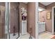 Elegant bathroom with a glass-enclosed shower, vanity, and decorative accents at 490 Hunters Glen Ct, Lawrenceville, GA 30044