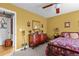 Cozy bedroom with traditional furniture, floral bedding, and decorative wall decor at 490 Hunters Glen Ct, Lawrenceville, GA 30044