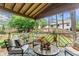 Cozy outdoor patio seating area with pillows and decorative rug at 490 Hunters Glen Ct, Lawrenceville, GA 30044