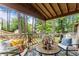 Cozy outdoor patio seating area with pillows and decorative rug at 490 Hunters Glen Ct, Lawrenceville, GA 30044