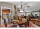 Inviting dining room with stone fireplace, vaulted ceiling, and room to entertain at 490 Hunters Glen Ct, Lawrenceville, GA 30044