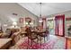 Traditional dining room with hardwood floors, chandelier, and sliding door to the backyard at 490 Hunters Glen Ct, Lawrenceville, GA 30044