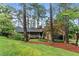 Beautiful single-Gathering home with a welcoming front porch and mature trees at 490 Hunters Glen Ct, Lawrenceville, GA 30044