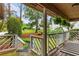 Covered front porch with stylish railings and views of the landscaped front yard at 490 Hunters Glen Ct, Lawrenceville, GA 30044