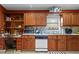 A cozy kitchen is fitted with plenty of storage and appliances at 490 Hunters Glen Ct, Lawrenceville, GA 30044
