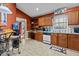 A bright kitchen area with a full appliance suite and a built-in desk at 490 Hunters Glen Ct, Lawrenceville, GA 30044