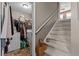Spacious laundry room with washer, dryer, storage shelves, and access to carpeted stairs at 490 Hunters Glen Ct, Lawrenceville, GA 30044