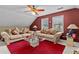 Cozy living room featuring neutral toned sofas, glass table, and a red carpet at 490 Hunters Glen Ct, Lawrenceville, GA 30044