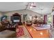 Open-concept living area connects to the dining area with hardwood floors and high ceilings at 490 Hunters Glen Ct, Lawrenceville, GA 30044