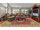 Comfortable living room with a large sofa, plush cushions, and lots of natural light at 490 Hunters Glen Ct, Lawrenceville, GA 30044