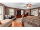 Spacious main bedroom with wood floors, comfortable bed, TV, and ample windows at 490 Hunters Glen Ct, Lawrenceville, GA 30044