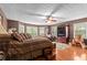 Cozy main bedroom with a ceiling fan, plush rug, and plenty of natural light at 490 Hunters Glen Ct, Lawrenceville, GA 30044