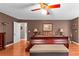 Spacious main bedroom featuring a ceiling fan and hardwood floors throughout at 490 Hunters Glen Ct, Lawrenceville, GA 30044