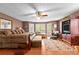 Relaxing main bedroom showcasing a sitting area, area rug, and outside view at 490 Hunters Glen Ct, Lawrenceville, GA 30044