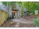 Backyard with a patio area, spiral staircases, and a wooded backdrop, blending nature and convenience at 1346 Peter Haughton Nw Way # 2, Atlanta, GA 30318