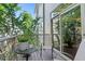 Cozy balcony with seating and views of lush greenery, offering a relaxing outdoor space at 1346 Peter Haughton Nw Way # 2, Atlanta, GA 30318