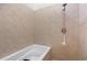 Modern bathtub with tiled walls and a sleek shower head, creating a spa-like experience at 1346 Peter Haughton Nw Way # 2, Atlanta, GA 30318