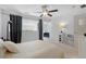 Well-lit bedroom featuring a ceiling fan, cozy decor, and views of the surrounding greenery at 1346 Peter Haughton Nw Way # 2, Atlanta, GA 30318