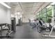 Well-equipped fitness center with modern exercise machines and large windows overlooking trees at 1346 Peter Haughton Nw Way # 2, Atlanta, GA 30318