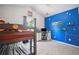 A fun bedroom with a bunk bed, desk, and bright blue walls at 207 Harmony Lake Dr, Canton, GA 30115