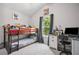 Playful ' bedroom featuring bunk beds, a window, and a desk area at 207 Harmony Lake Dr, Canton, GA 30115